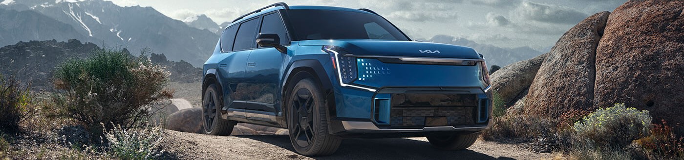 2026 Kia EV9 parked on sandy terrain